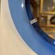 Mirror framed by a blue glass circle, italy circa 1950