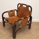 Pair of Tito Agnoli armchairs in leather and bamboo, 1970s.