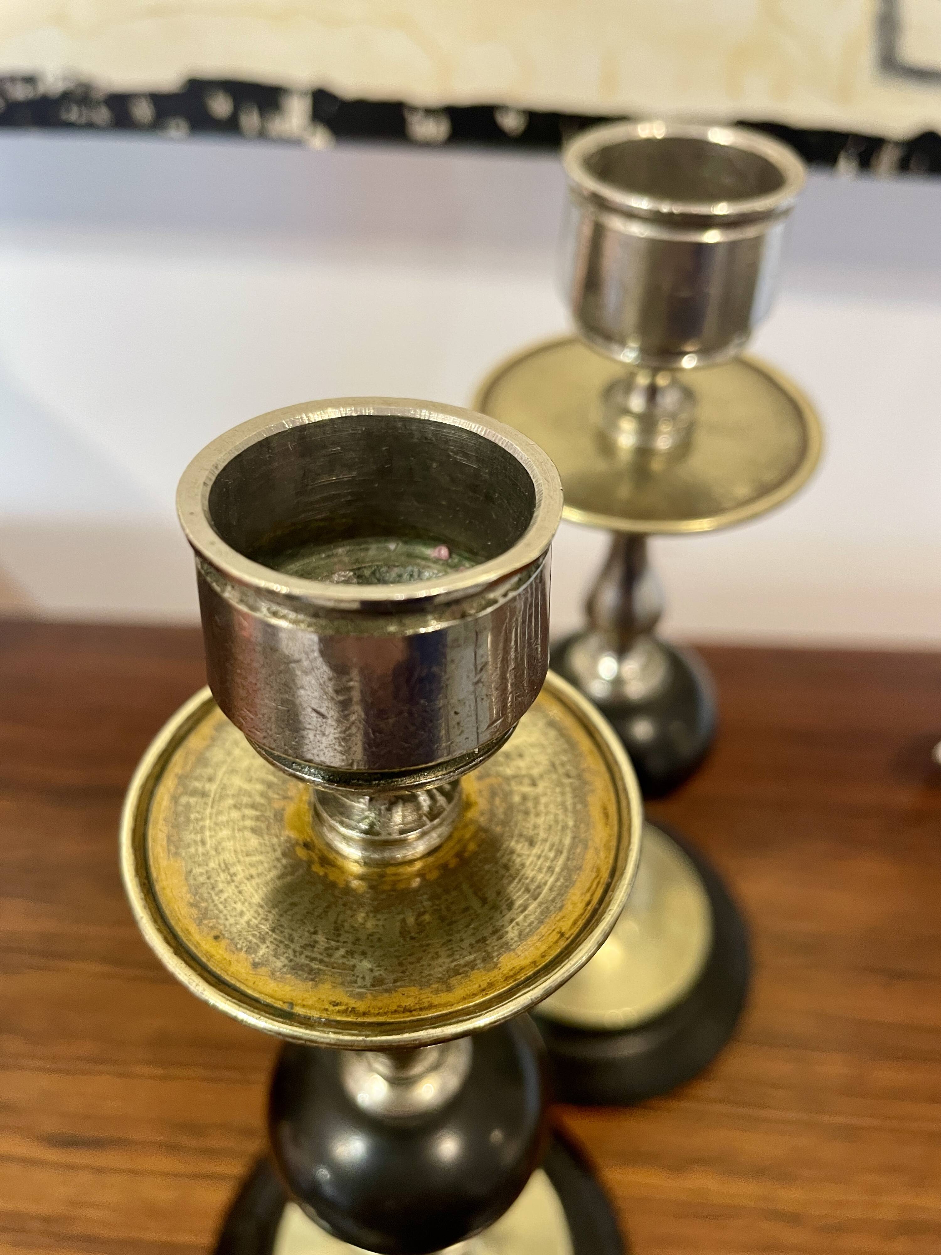 Pair of Napoleon III candlesticks in brass and black marble.