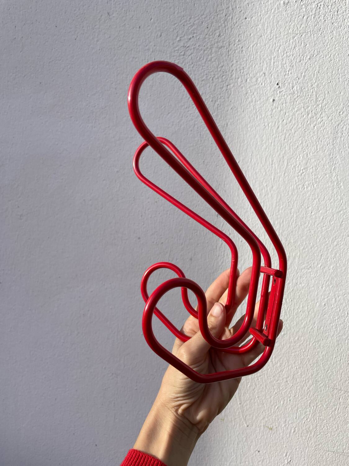 Pair of red metal wall hooks