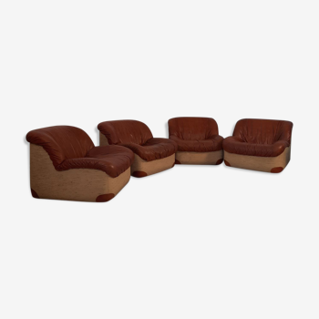 Four vintage armchairs, leather and fabric, 70s