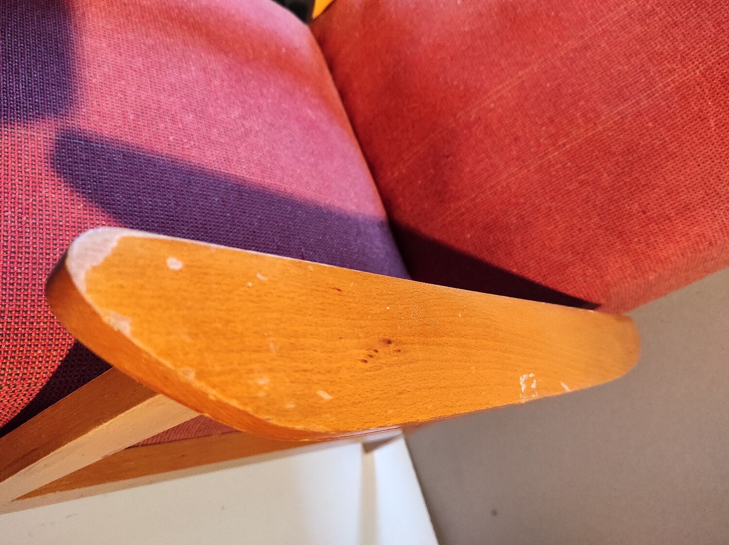Vintage red armchair with compass feet in Scandinavian design