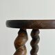 Small antique tripod stool in dark wood.