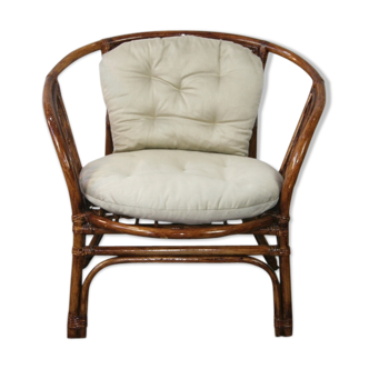 Vintage rattan chair with 1970 cushions