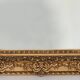 Wooden mirror and gilded stucco decorated with rockery style rinceaux and shells