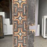 Indonesian construction element in carved wood with cross pattern in red, white geometric frieze
