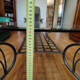 Black wrought iron coffee table and Roche Bobois glass top