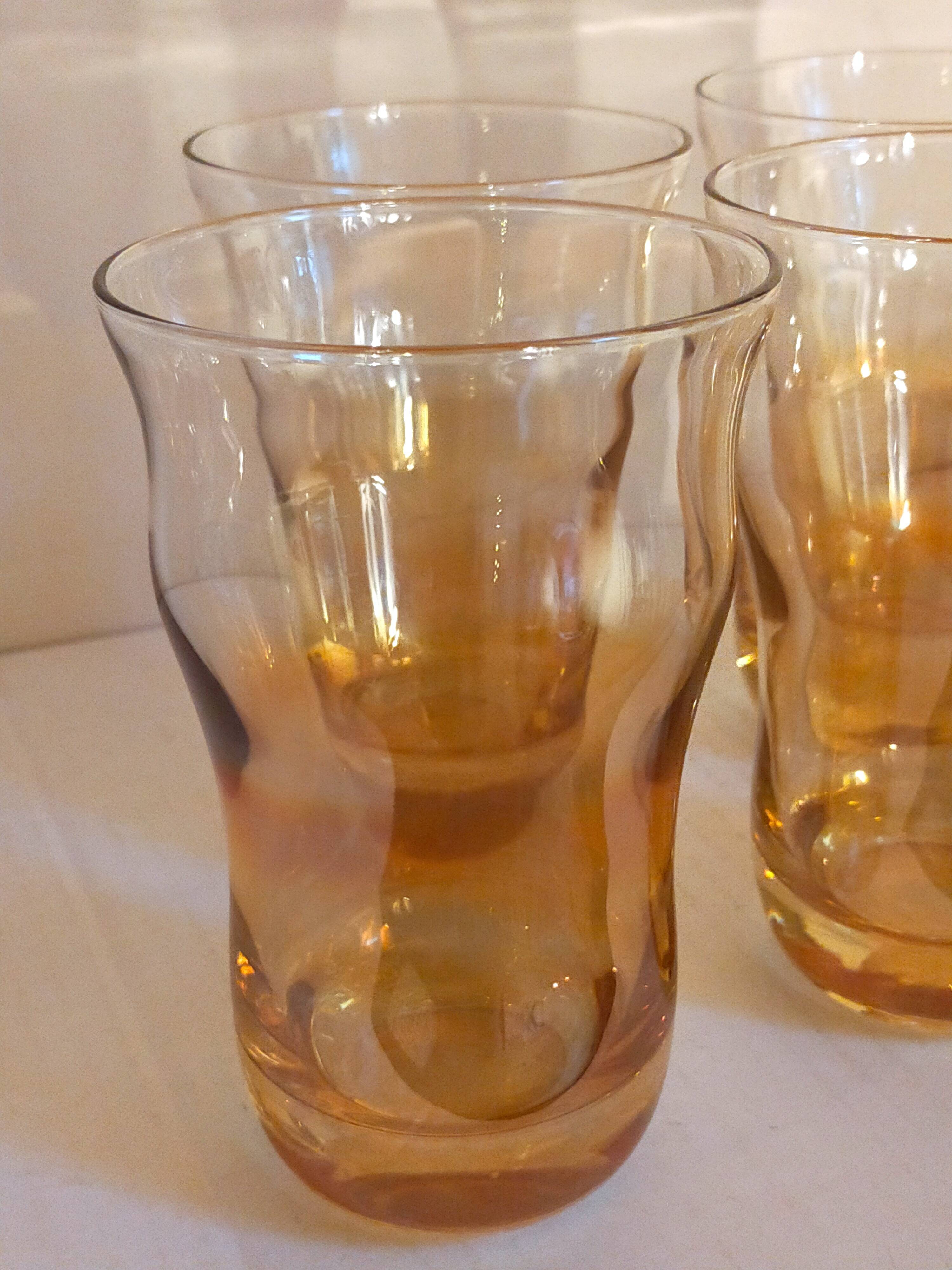 Four iridescent honey blown glass glasses