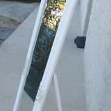 Large wooden mirror on tilting psyche stand in whitewashed gold with molding