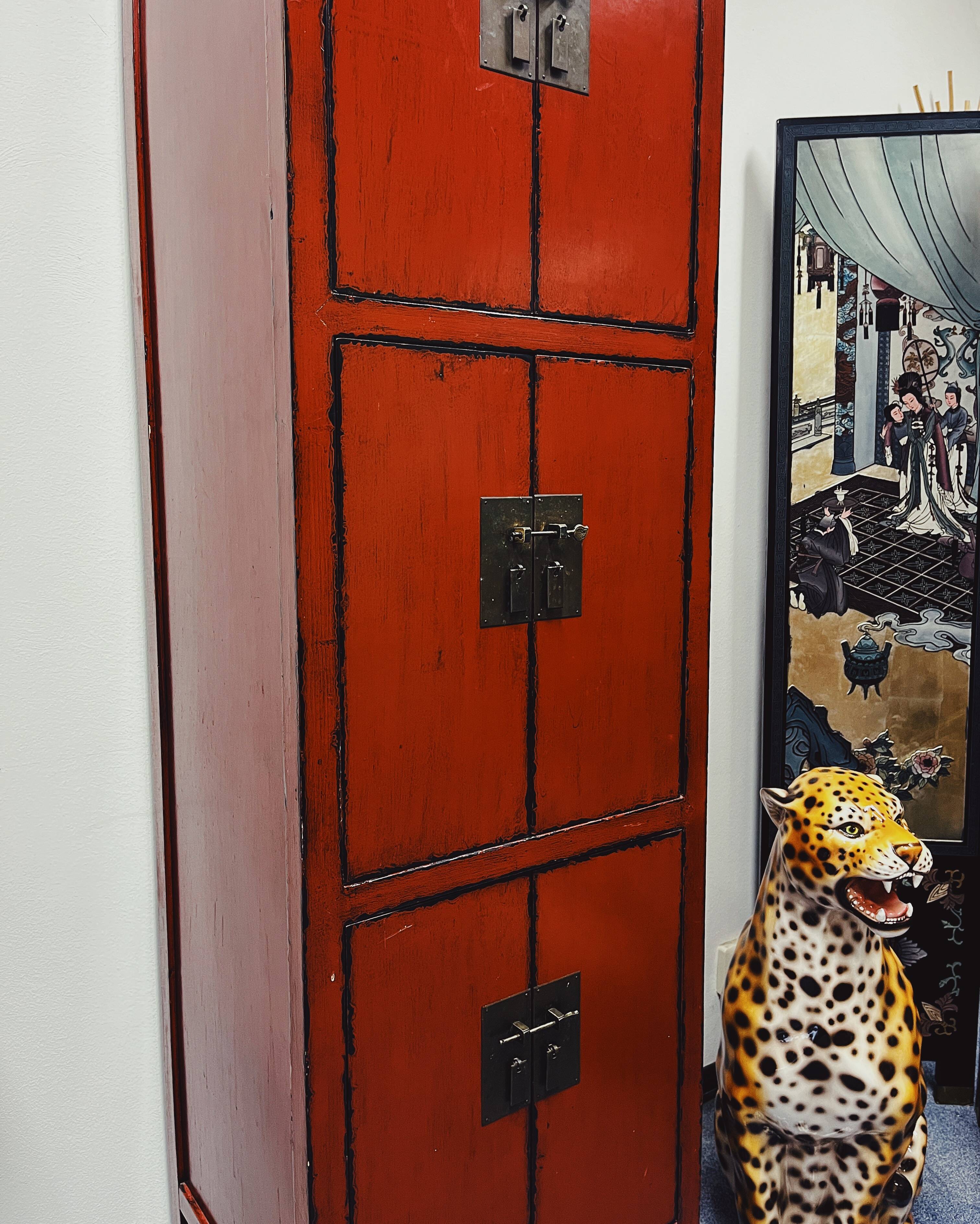 Red Chinese cabinet with three doors