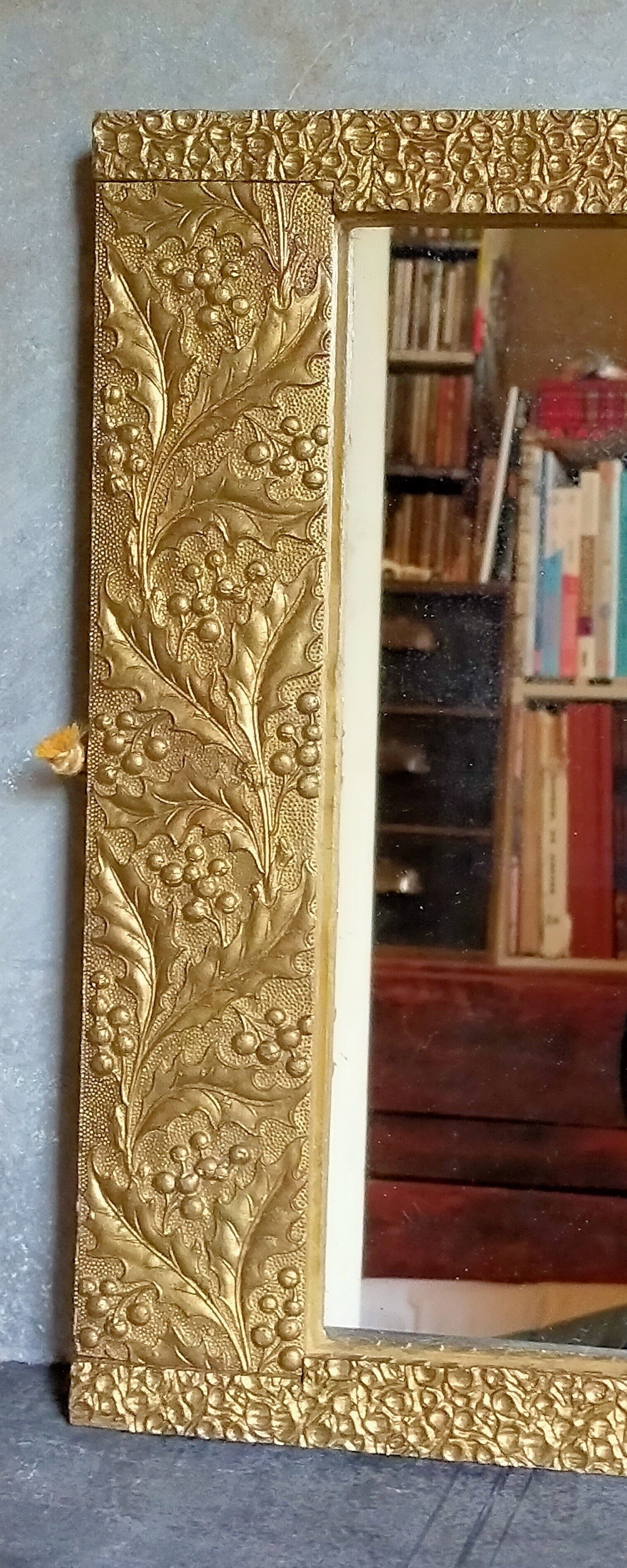 Art-deco gold mirror with vegetal décor  52x31cm