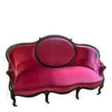 Moulded and carved wooden canapé, Napoleon III period.