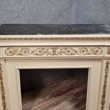 Louis XVI fireplace made in the 19th century, all in lacquered and gilded wood with decorative attributes