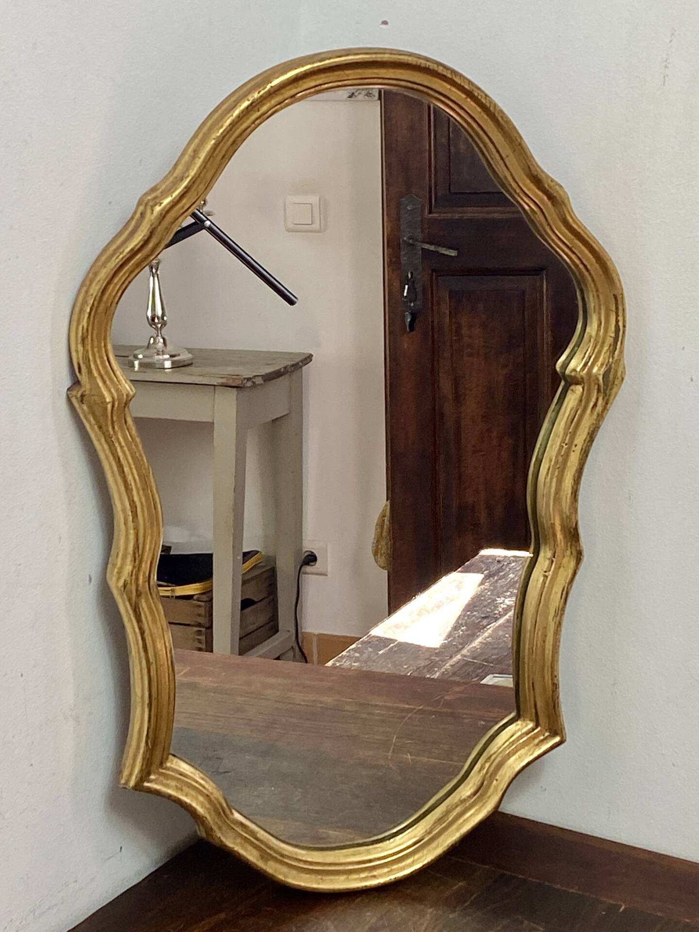 Large baroque mirror in gilded wood