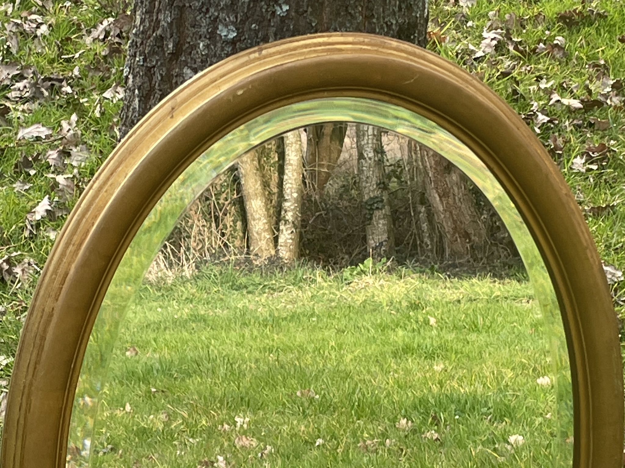 Bevelled golden oval mirror, 79 x 59 cm