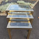 Nested tables by Pierre Vandel Paris in gilded metal and glass, 1970s.