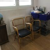 Pair of vintage rattan and leatherette armchairs