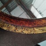 Golden oval art deco mirror