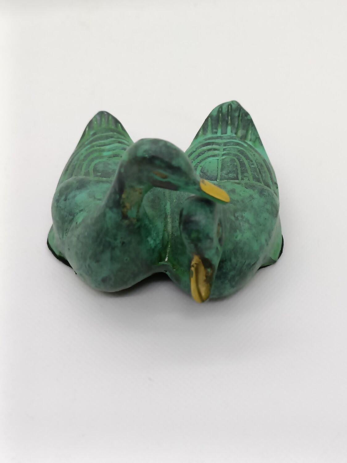 Two green and golden ducks in brass