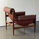 Fauteuil Amiral d'Eric Merthen, en cuir et palissandre