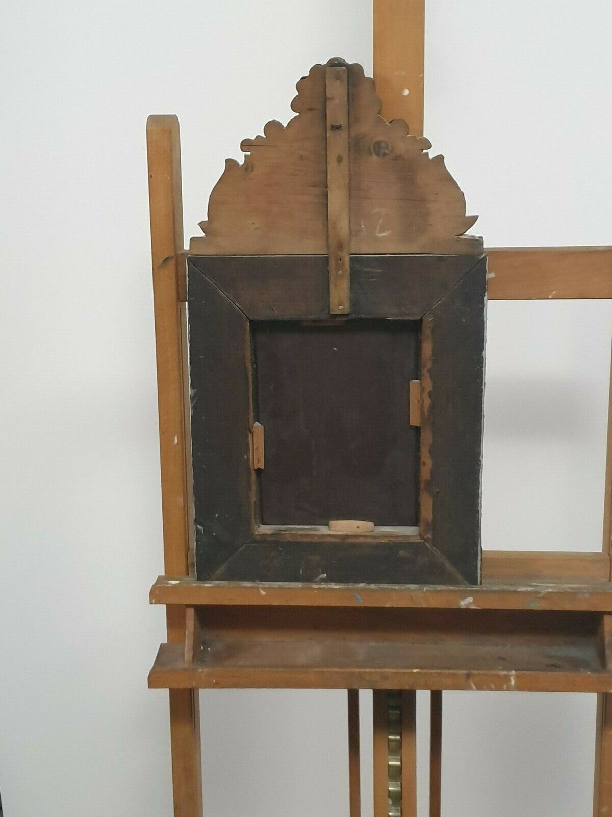 Old bevel mirror with metal parcloses pushed back Louis XIV style