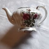 Musical teapot in white porcelain with floral decoration