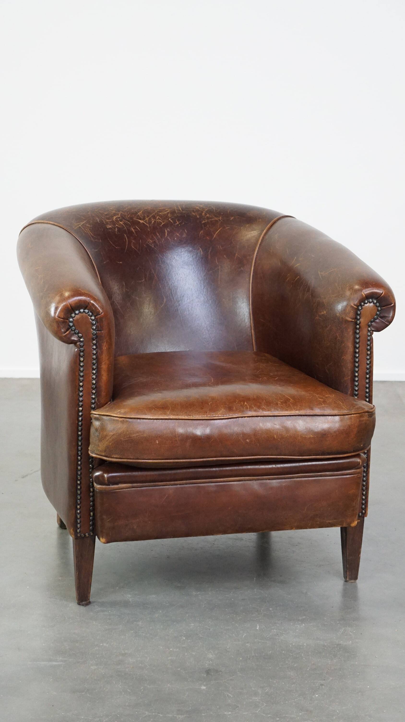 English style sheep leather club chair finished with decorative nails