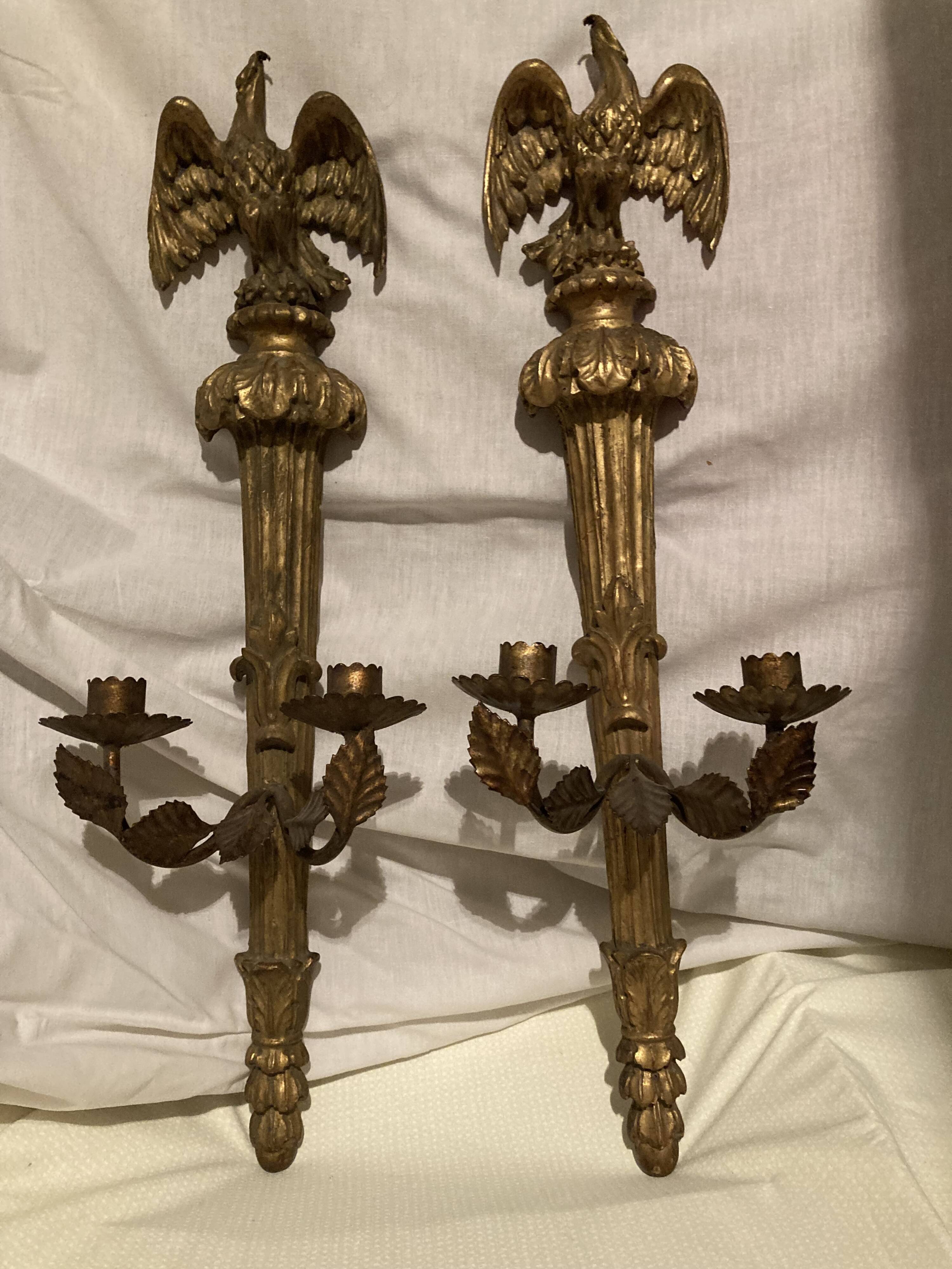Pair of candle holders in wall, eagle pattern in gilded wood and brass