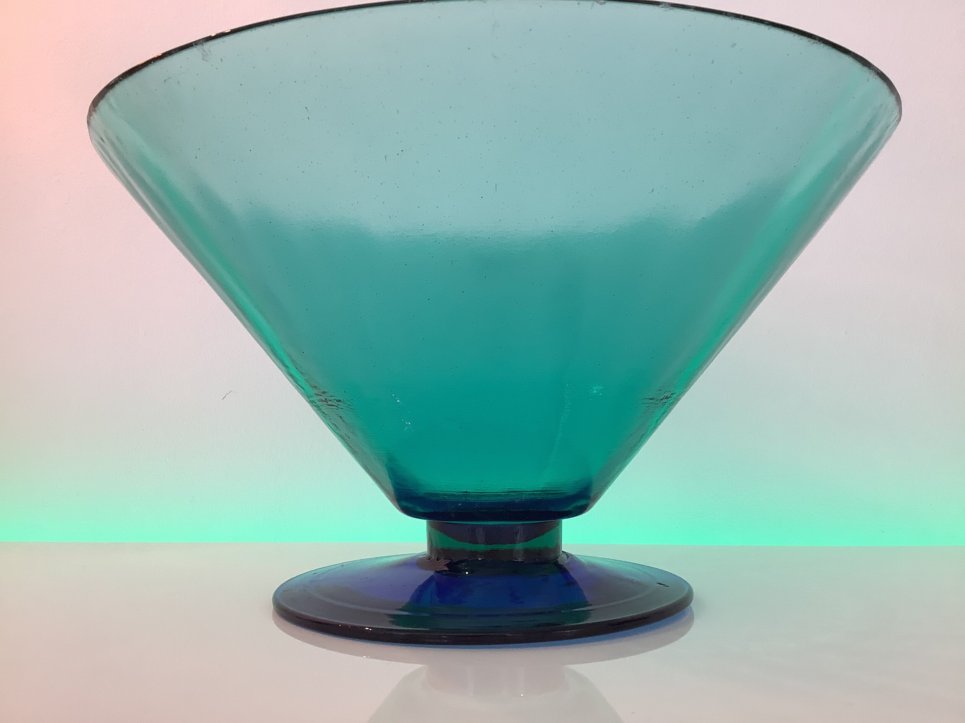 Glass fruit cup on foot, green and blue
