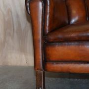 Victorian Chesterfield leather canapé with oak lion claw feet.