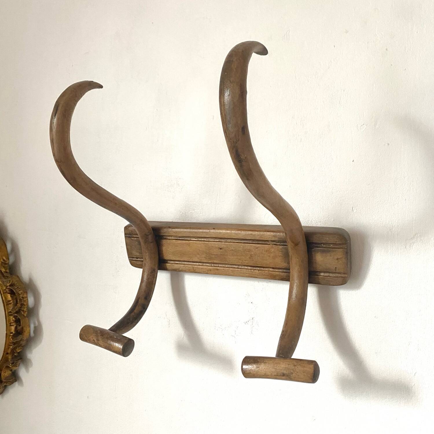 Curved wooden coat rack from the early 20th century