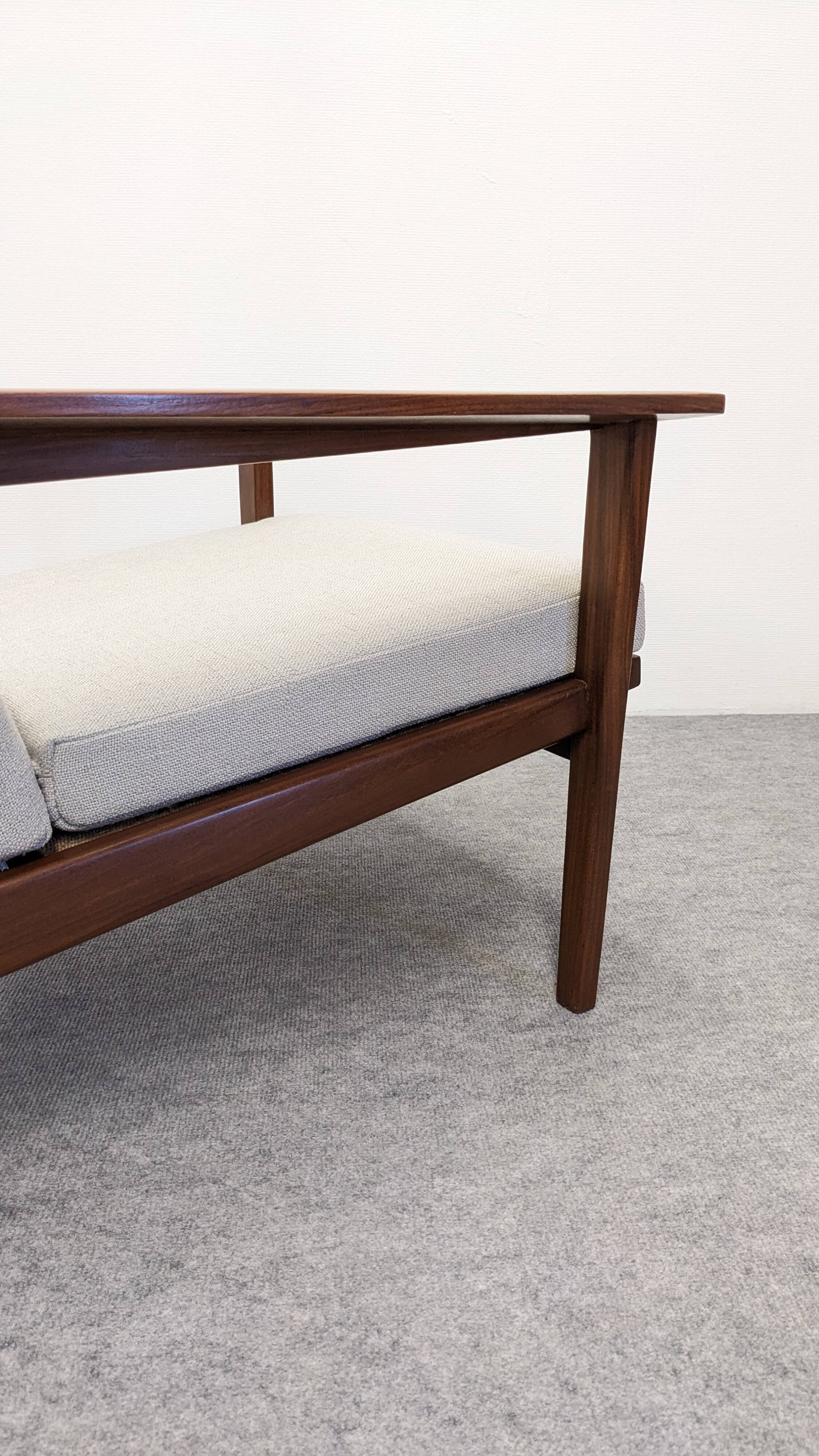 Pair of Scandinavian style armchairs in teak, France circa 1950.