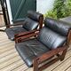 Vintage Scandinavian armchairs in leather and solid wood.