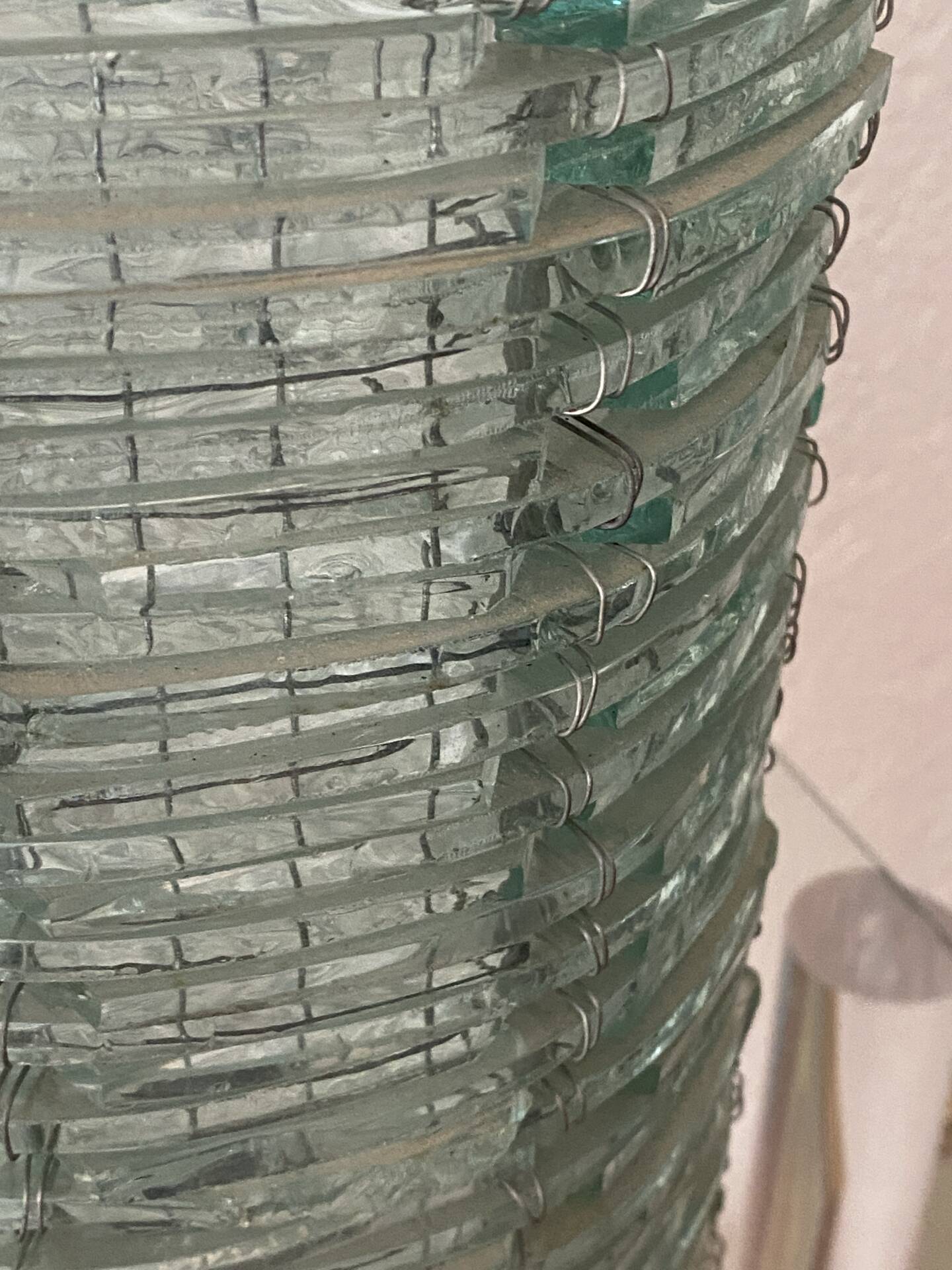 Blue-tinted glass lamp and wire.