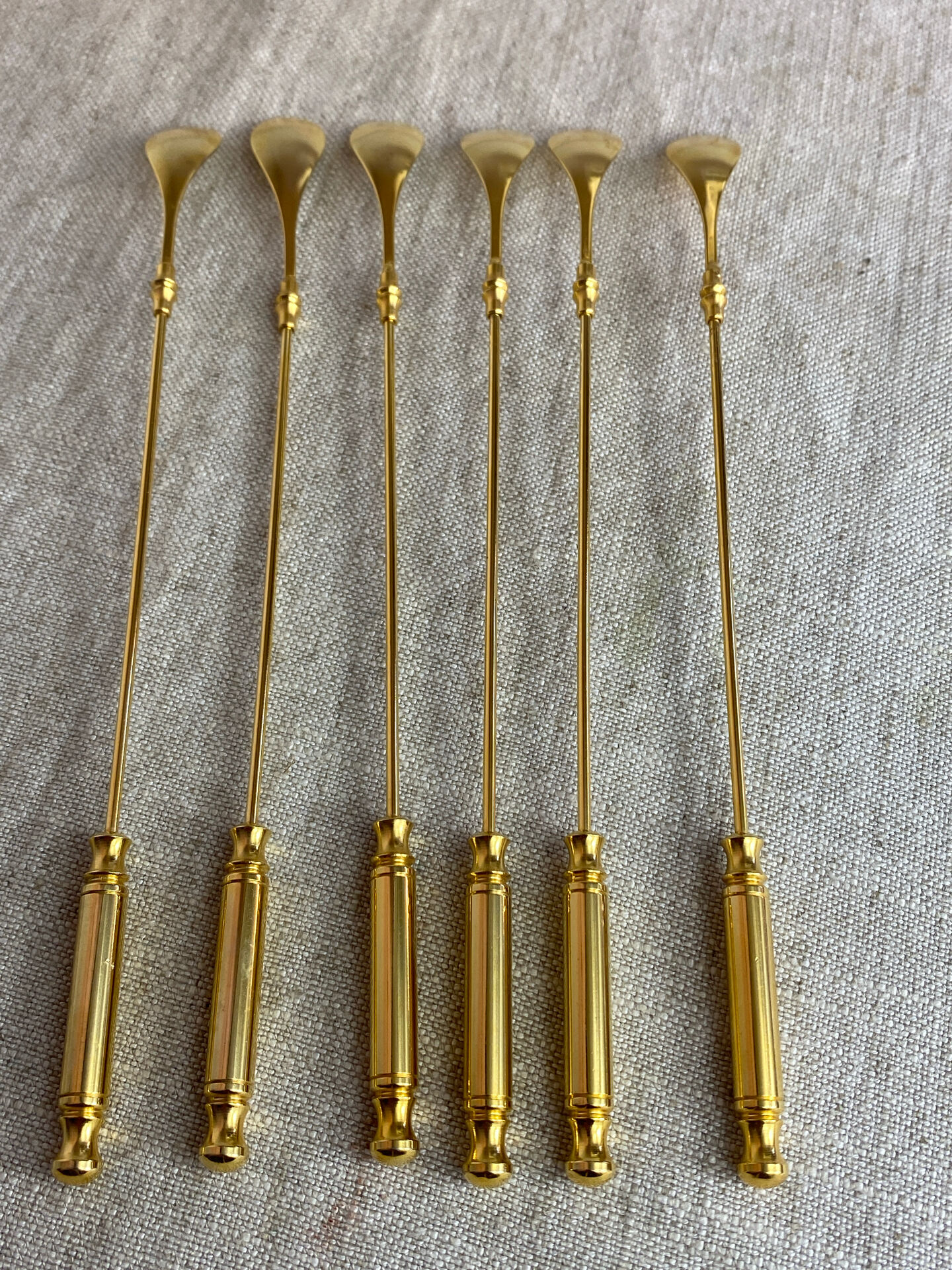 Long coffee or cocktail spoons in gold plating