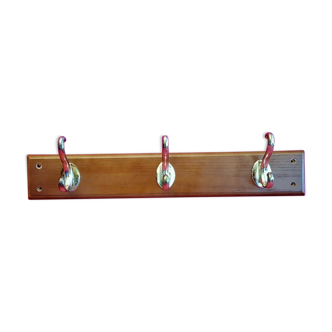 3 gilded metal coat racks on wooden support