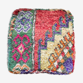 Moroccan berber pouf colored in yellow wool terracotta green and purple