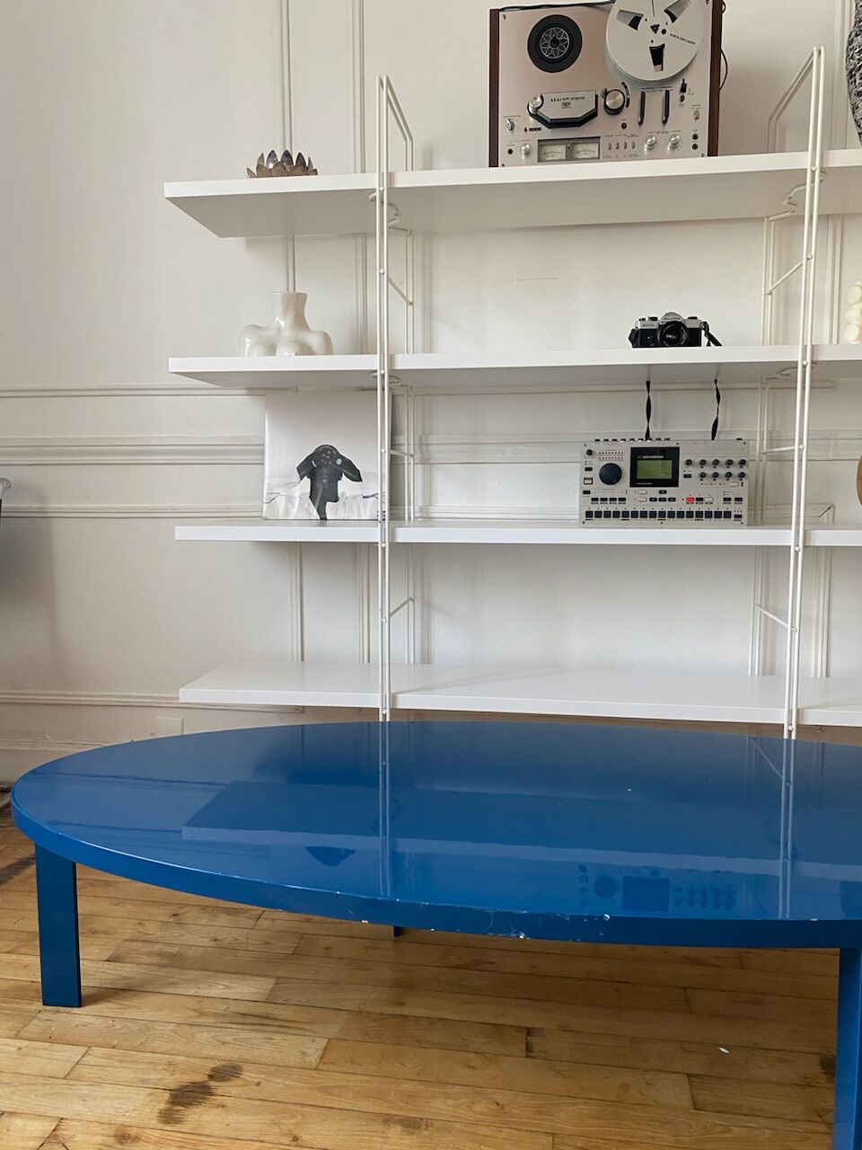 Oval coffee table in blue lacquered wood