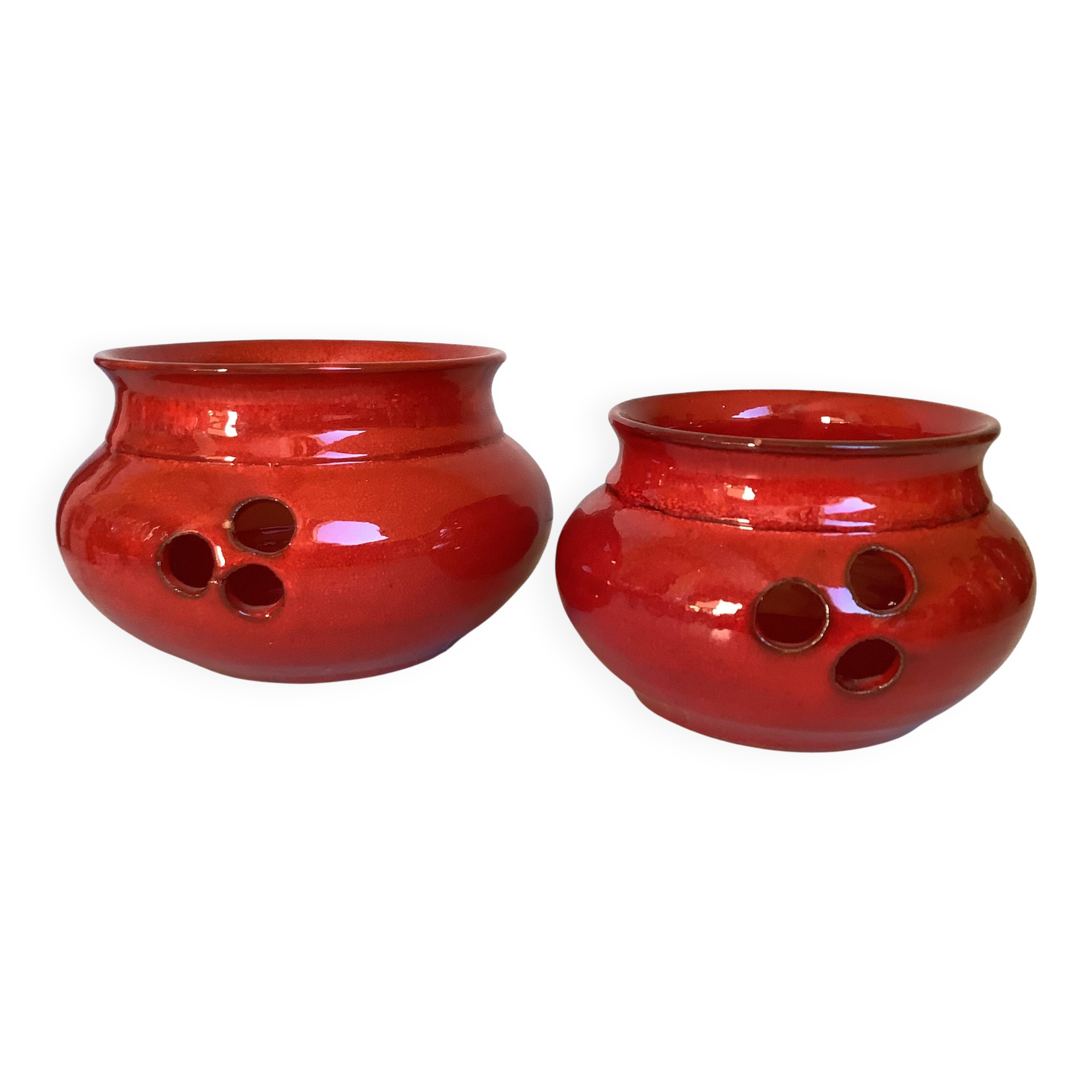 Pair of red Scandinavian candle holders.