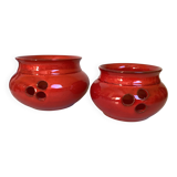 Pair of red Scandinavian candle holders.