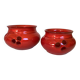 Pair of red Scandinavian candle holders.
