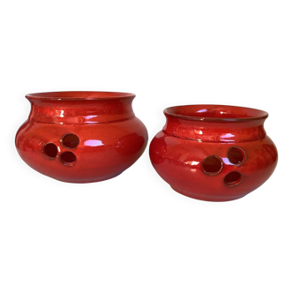 Pair of red Scandinavian candle holders.