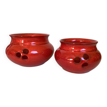 Pair of red Scandinavian candle holders.