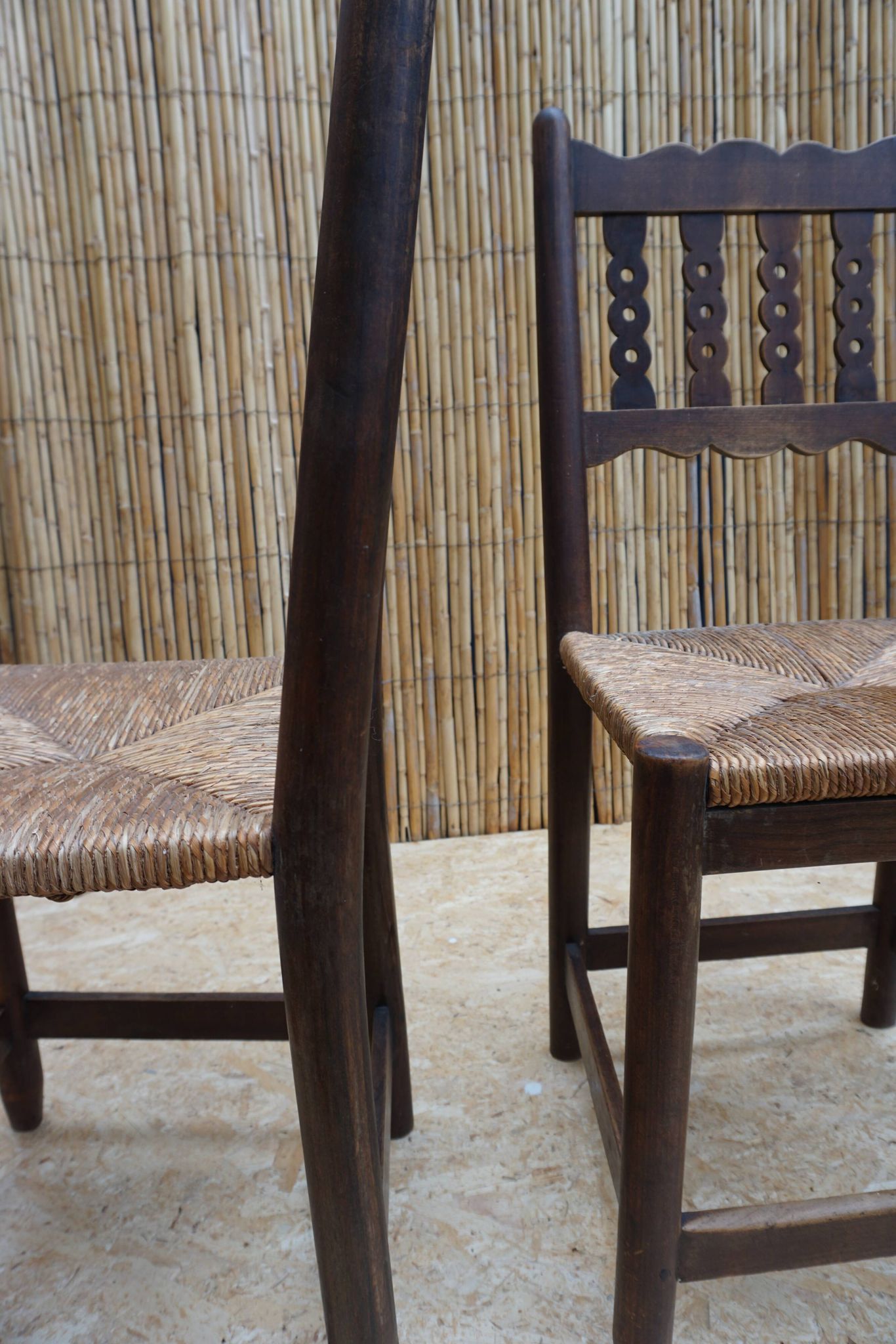 Pair of antique straw-seated farm chairs