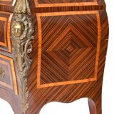 Tomb-shaped commode in Louis XV style with decoration featuring Spanish figures.