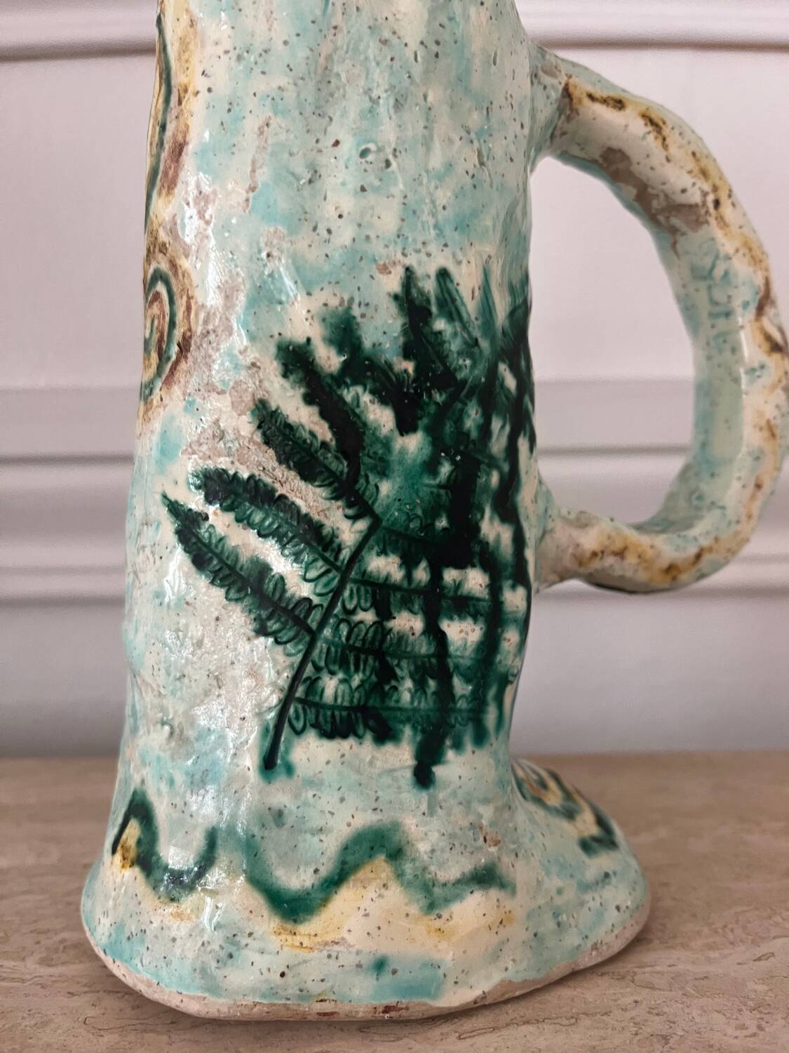 Antique handcrafted ceramic pitcher