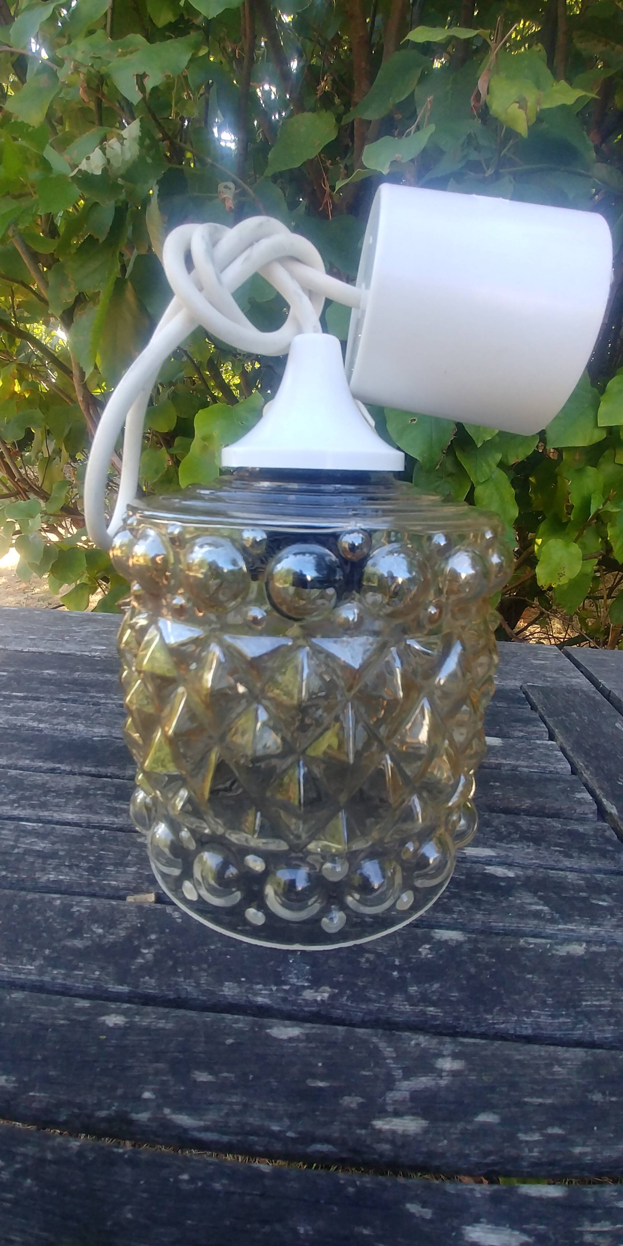 A 70s-vintage amber molded glass "bubble" pendant/lamp
