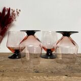 4 pink glasses with black stem