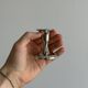 Small shiny metal candle holder