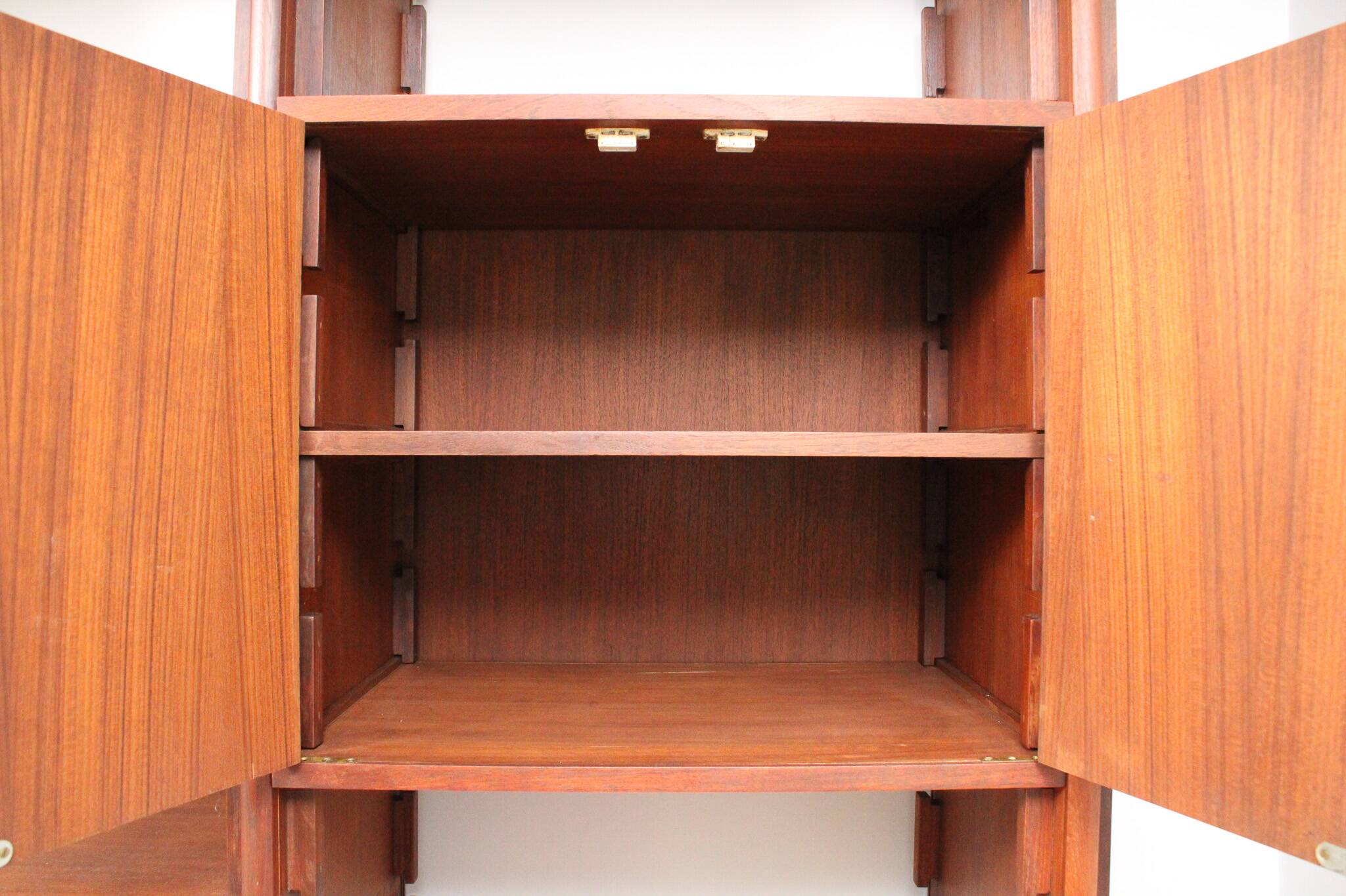 A vintage mid-century teak Gianfranco Frattini style bookcase room divider